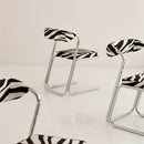 Vintage chrome chairs upholstered in zebra-print velvet